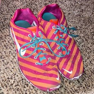 Nike womens running shoes size 10 in great condition awesome pink & orange color